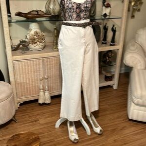 Is pair of wide leg pants and a sleeveless animal print bodysuit top